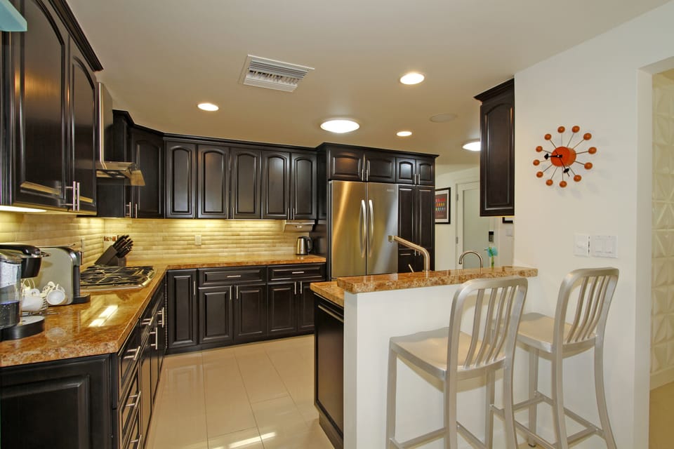 Kitchen, with SS appliances and cabinets fully stocked with the comforts of home