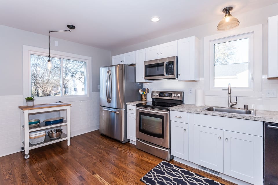 Fully renovated kitchen with stainless steel appliances.