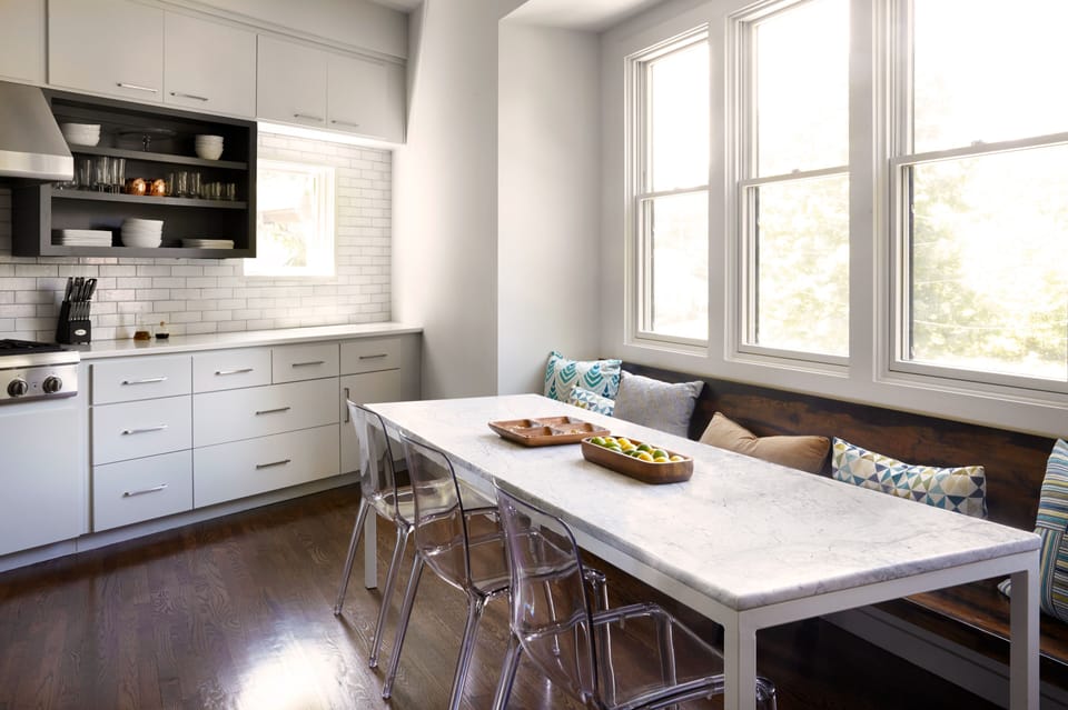 Kitchen seats an additional 13 people with island & banquette seating.