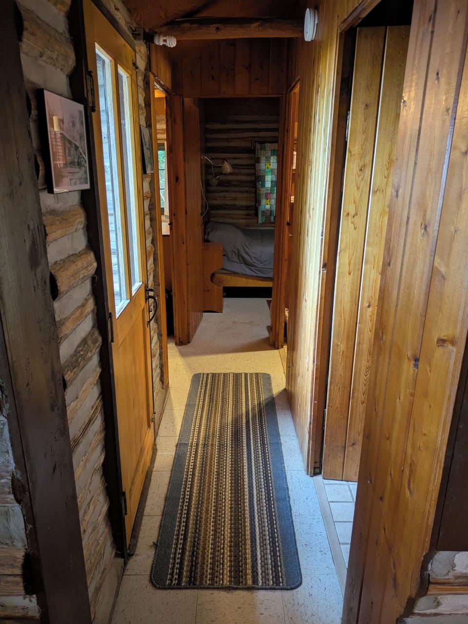 Hallway leading to two downstairs bedrooms and bathrooms. 