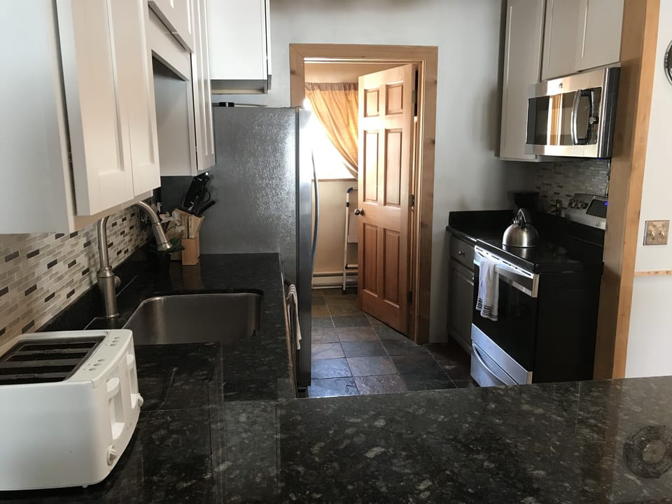 Laundry is to the left of the window in the pantry 