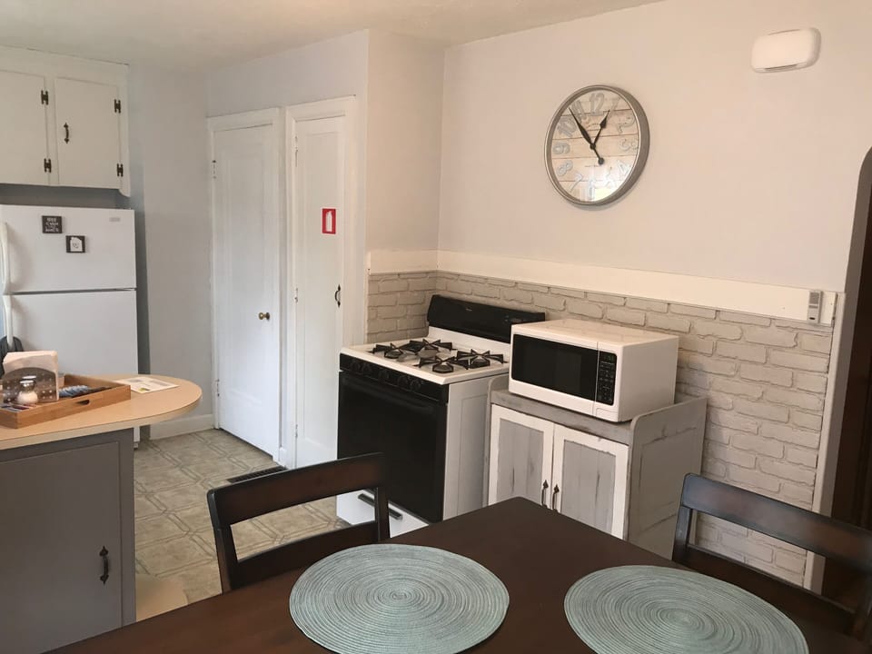 Gas oven/stove and microwave for all your cooking needs.