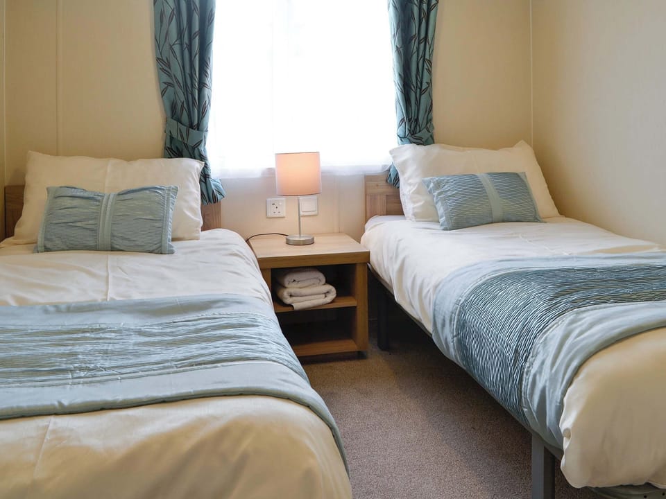 Comfortable bedroom with twin single beds | Beachcomber Lodge, Southerness, near Dalbeattie