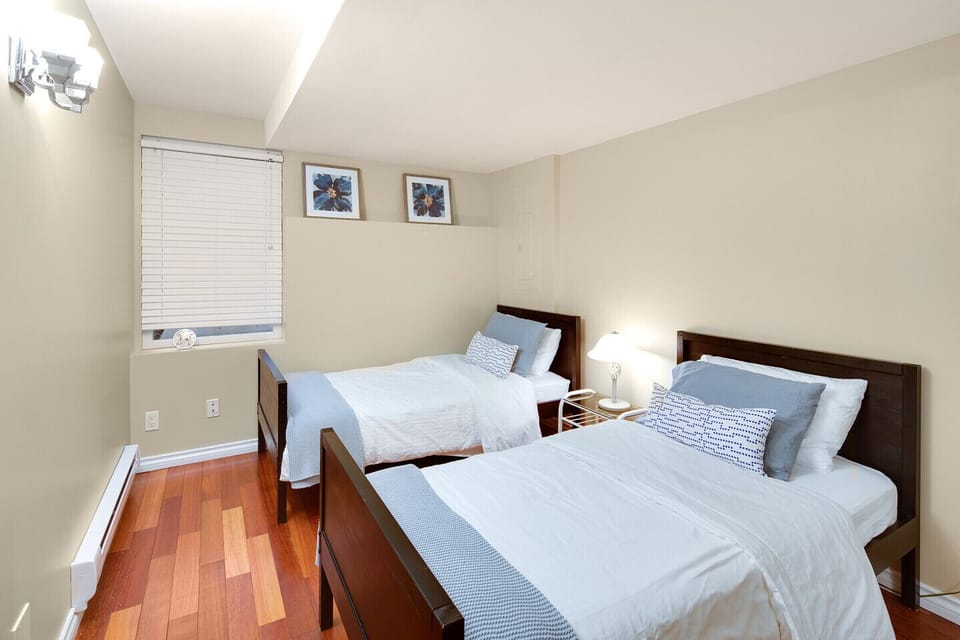 Second bedroom in suite. Two sin