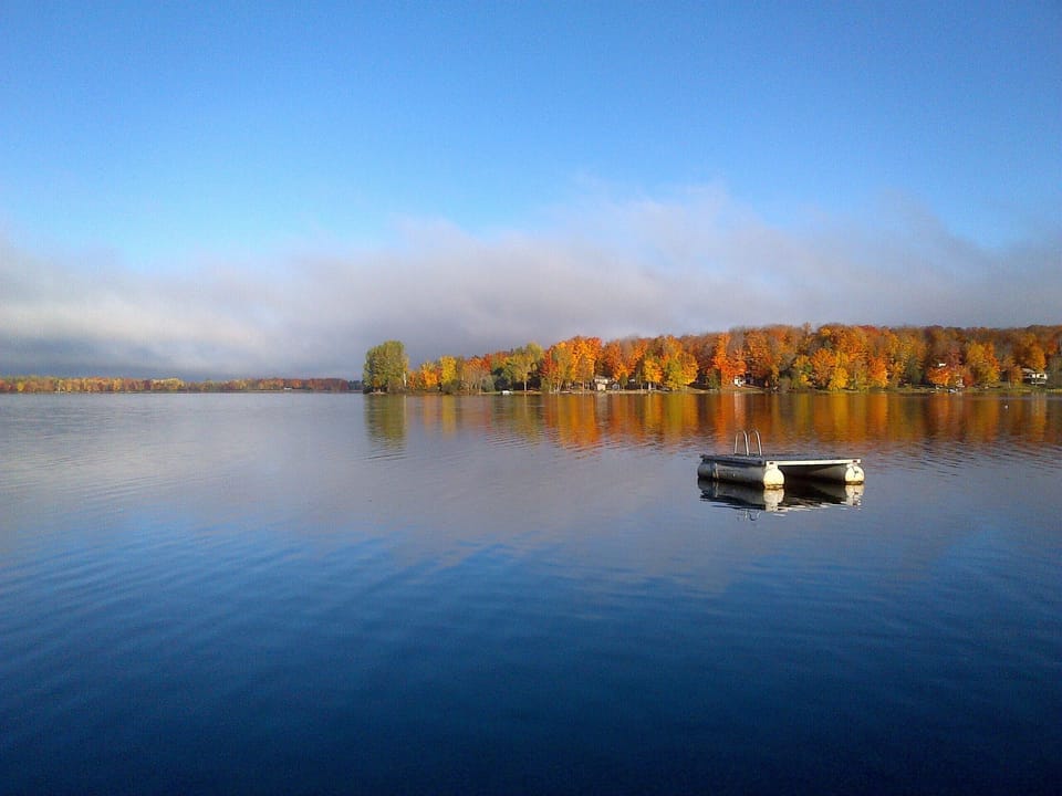 Beautiful Sandy Beach with sitting area, dock, and swimming raft!