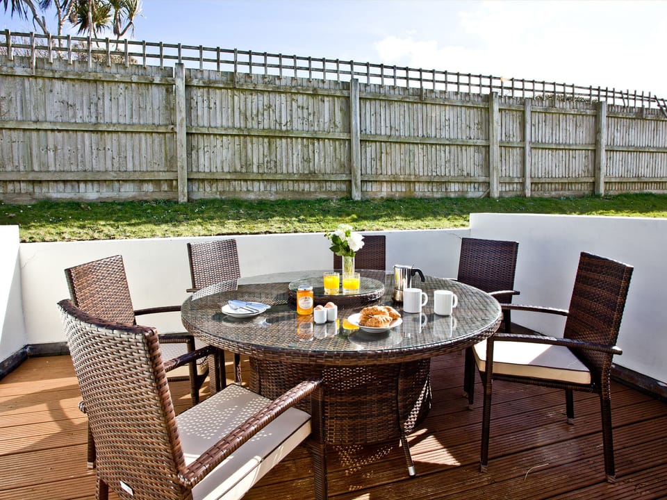 Decked area with outdoor seating | Sea Glimpses - Glendorgal, Newquay