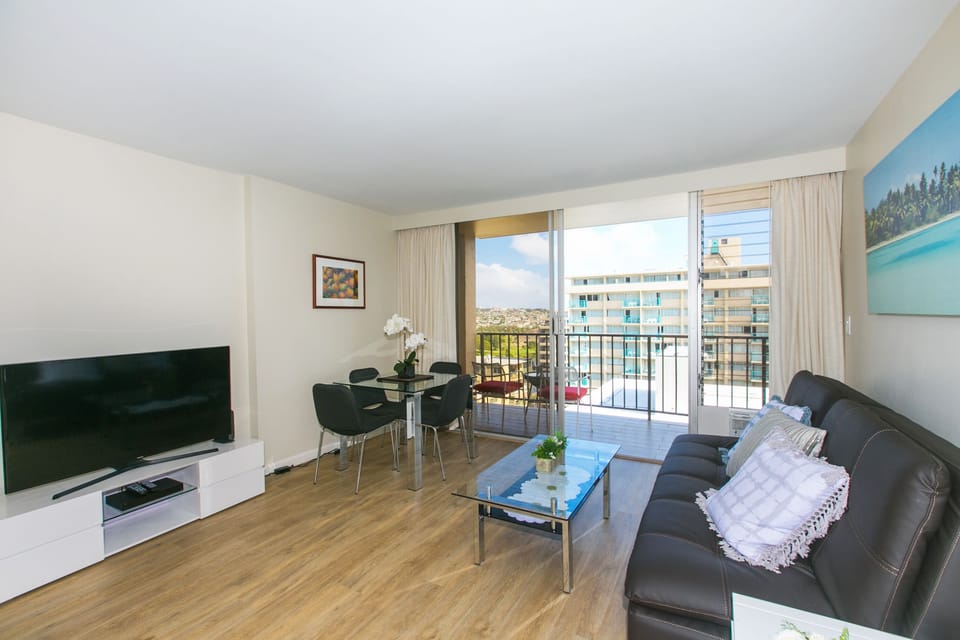 Living/Dining area large Lanai w/view of Ala Wai Canal and golf course.