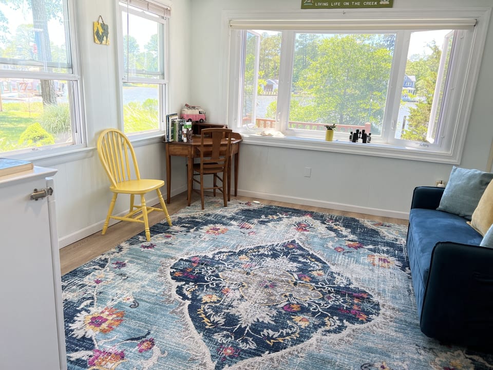 Bright, modern Florida room with 2 comfortable twins.  Act as 3rd bedroom option
