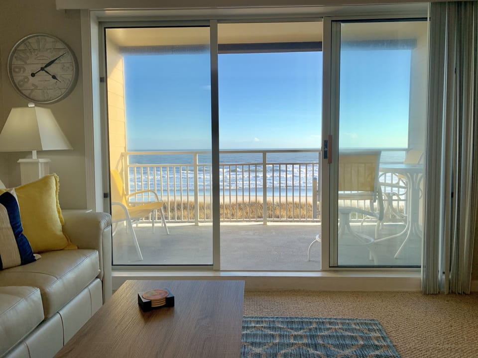 View of ocean from living room couch 