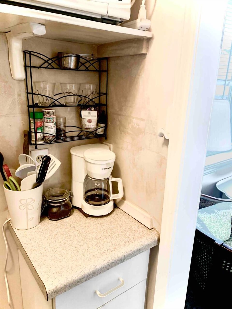 The kitchen is well stocked, has space for 
storage and a small separate freezer