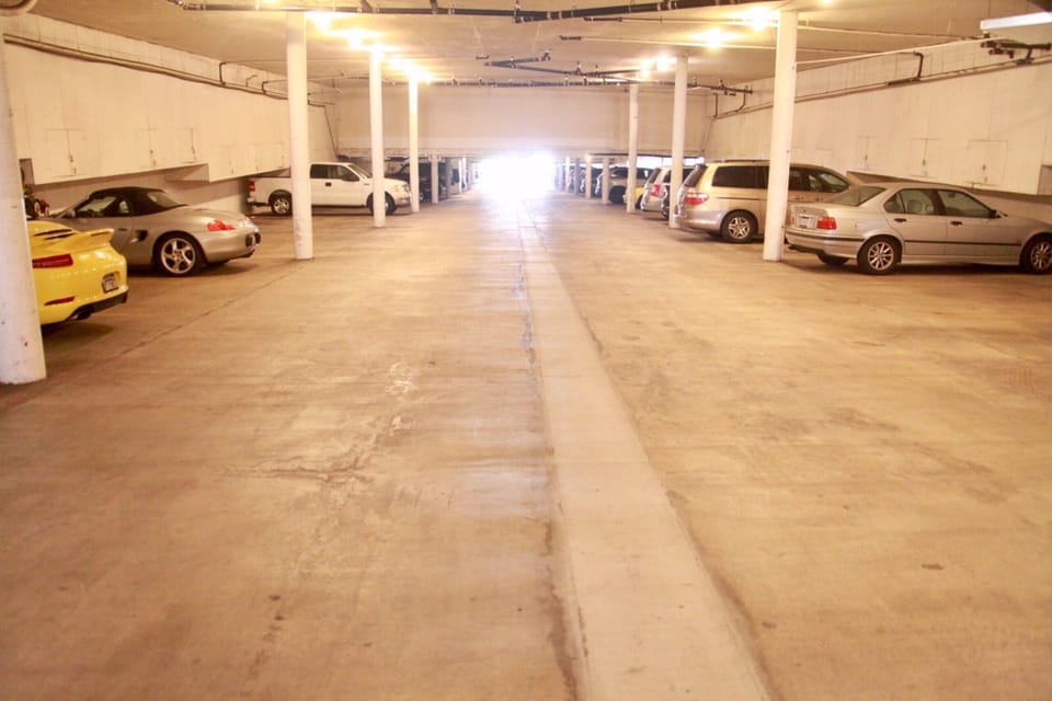 Gated, coded, secure garage will keep your car safe, and coo-ol. Two spaces.