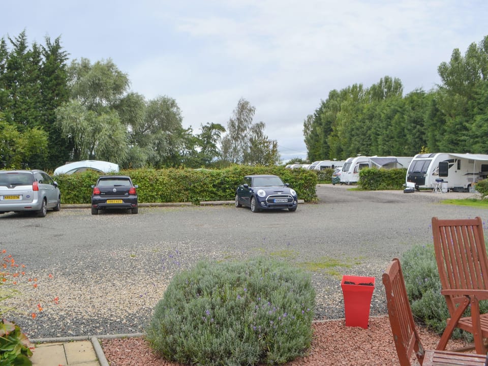 Parking area with small camp site to rear | Dove Cottage, Stable Cottage, Rose Cottage - Railway Cottages, Acklington, near Amble
