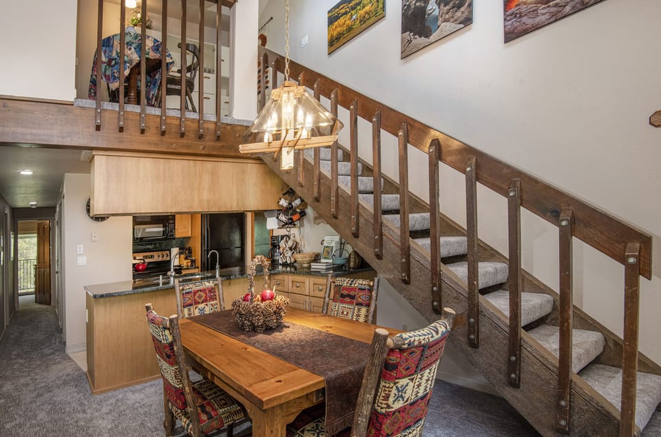 Spacious Kitchen, hallway leading to bedrooms and stairs to Master Suite.
