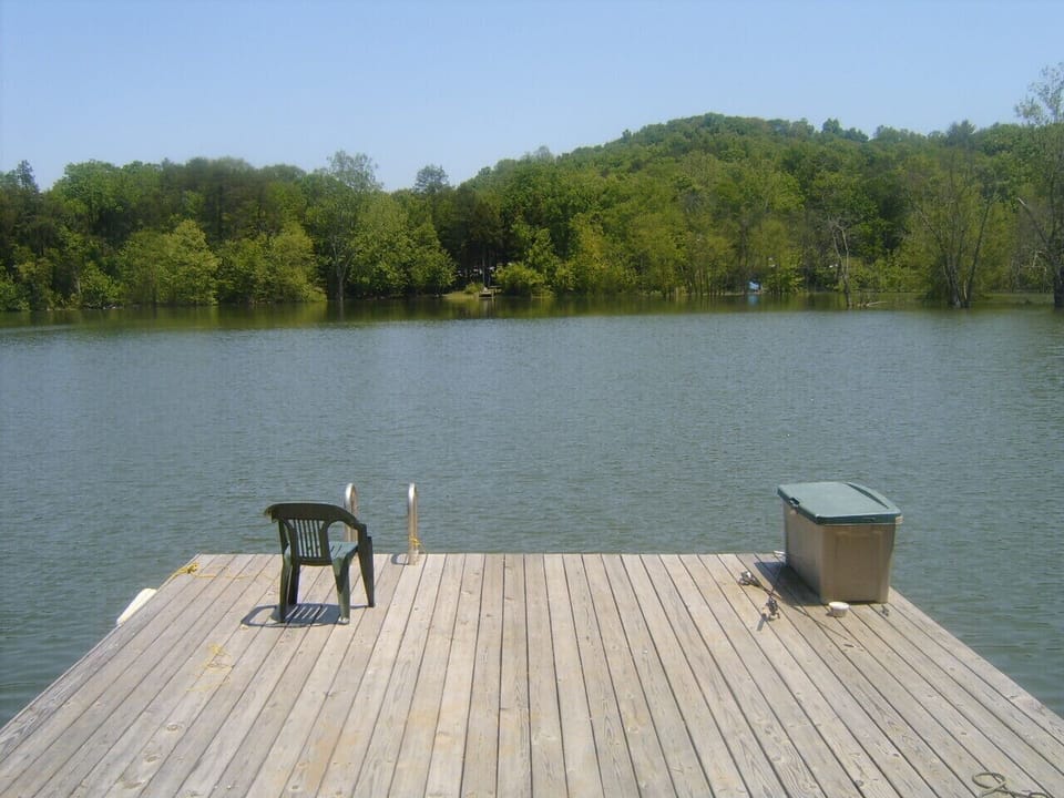 Private boat dock with swimming ladder on quiet cove resting in 30+ ft of water