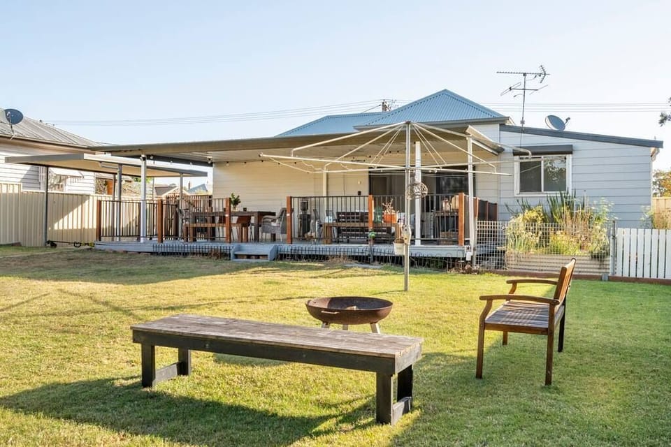 Huge 42 sqm covered deck with 8 person dining table, Weber BBQ and sofas.