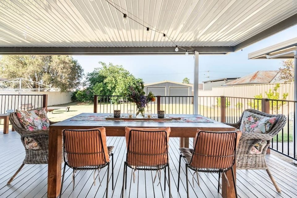 Huge 42 sqm covered deck with 8 person dining table, Weber BBQ and sofas.