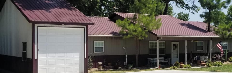 Water front lake house, dock, fire pit, and large screened in deck!