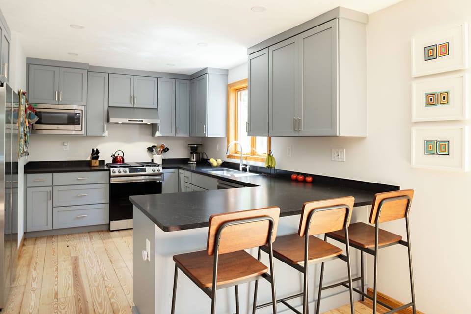 The large kitchen counter, with seats for three
