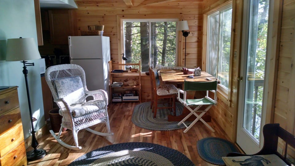 dining area from living area, kitchen to left of fridge