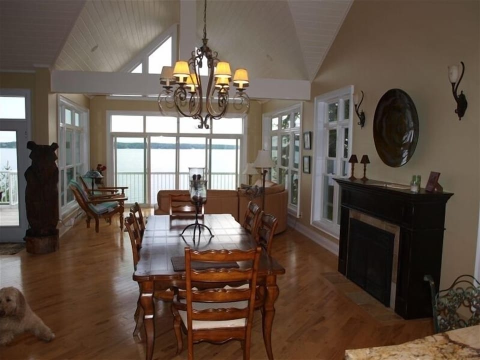 Open concept dining area with fireplace and sunroom to watch the sunset