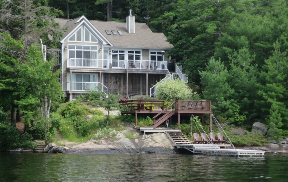 2nd view of cottage from the lake with new docks