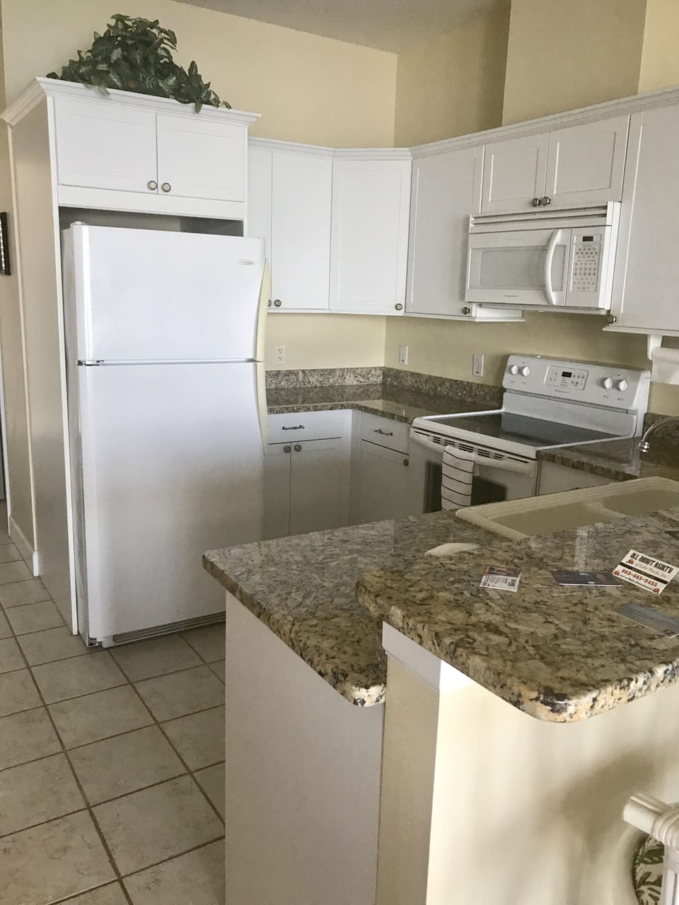 Fully equipped kitchen with granite countertops.