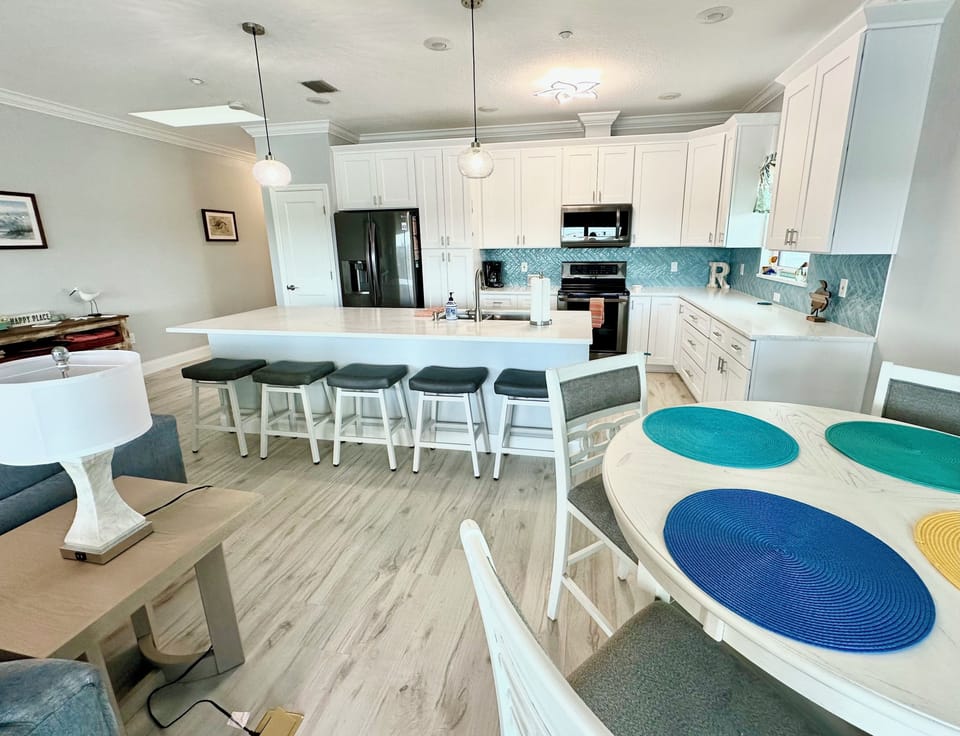 Counter height dining table and additional seating at island