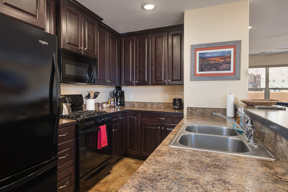 Fully equipped kitchen with new appliances and all the items you need to make group meals during your stay!