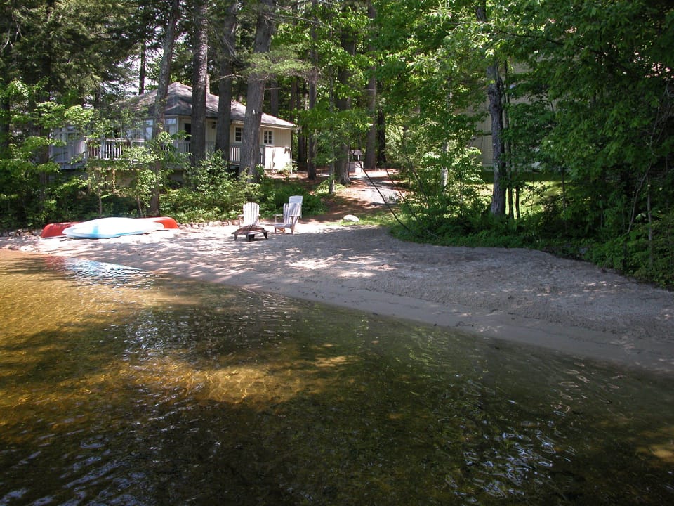 private broad sand beach that is rock free on shore and in the water