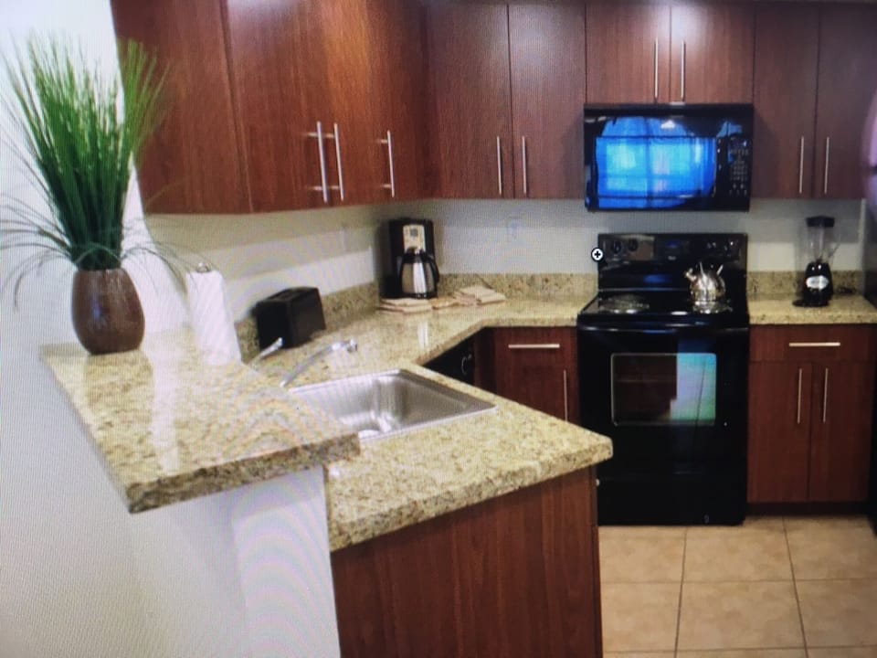 Fully stocked kitchen with granite counter tops