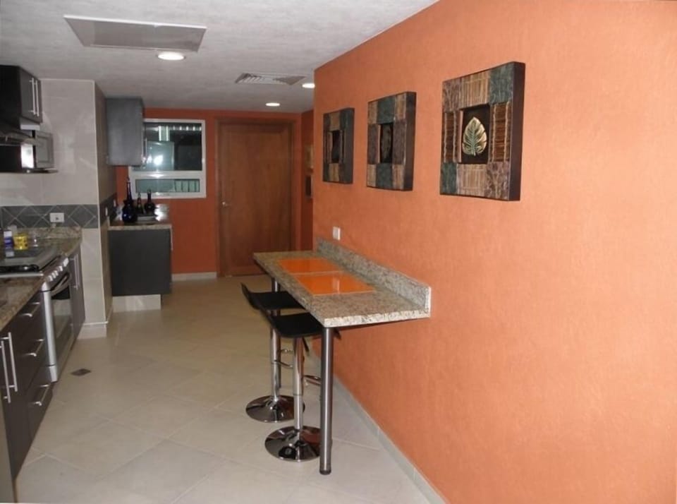 THE KITCHEN IS FULLY EQUIPPED AND ROOMY FOR ENTERTAINING