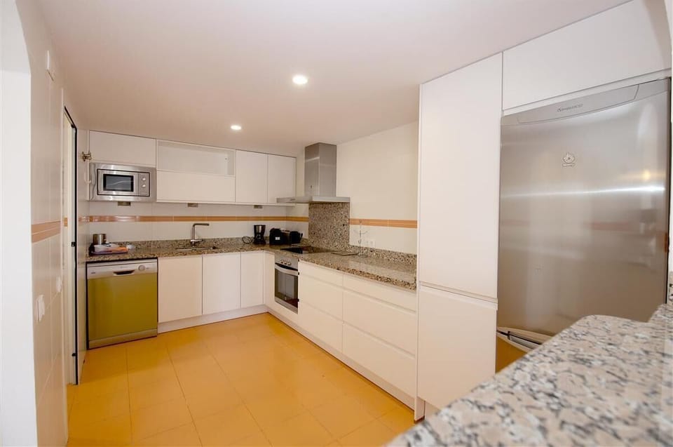 Spacious kitchen is fully equipped with all the appliances
