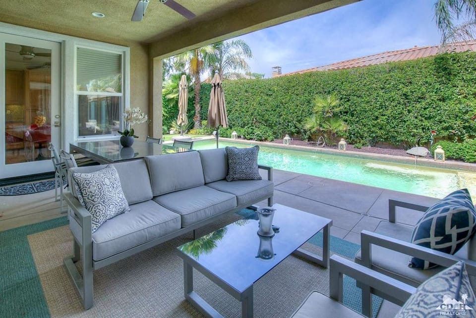 Come outside to Sitting Area with Misting System and Ceiling Fan for comfort.