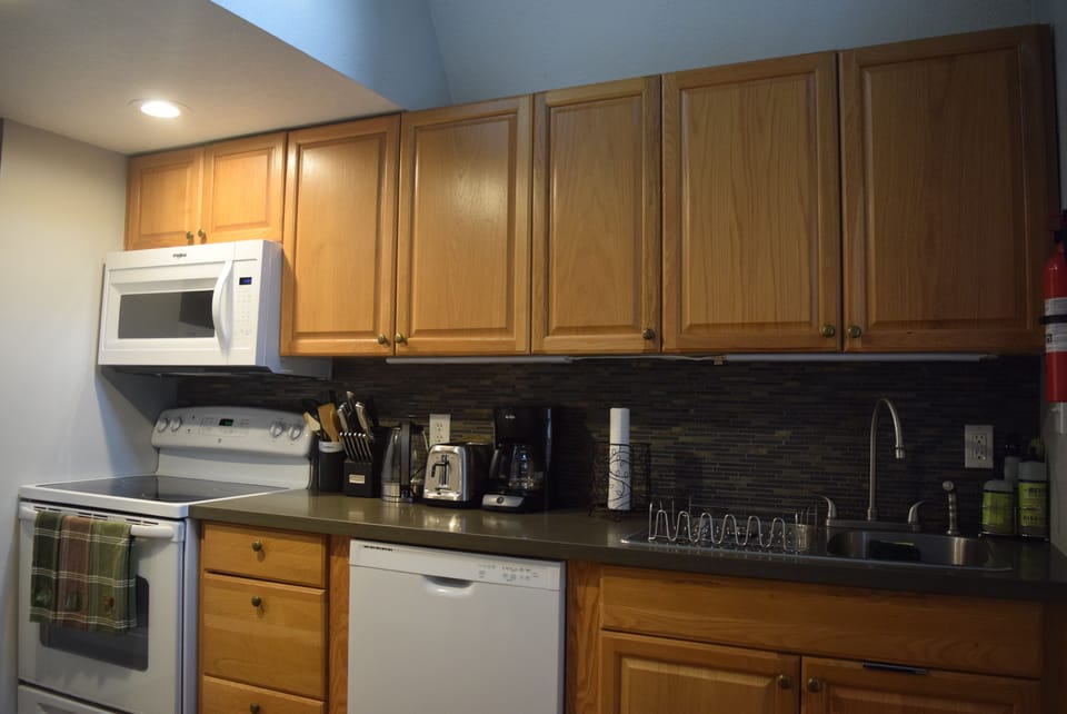 Entrance opens  into bright, spacious, fully stocked kitchen