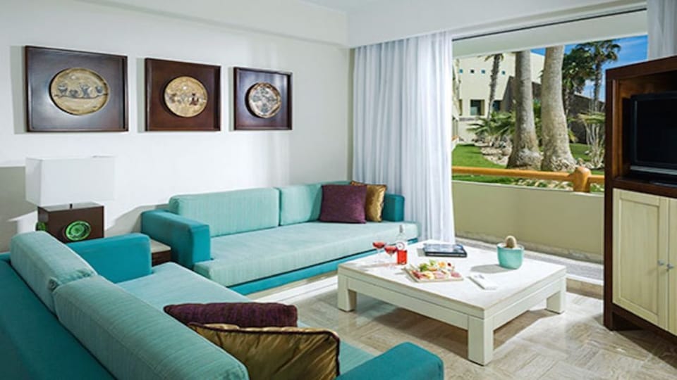 Living room couches convert to beds and have trundles beneath