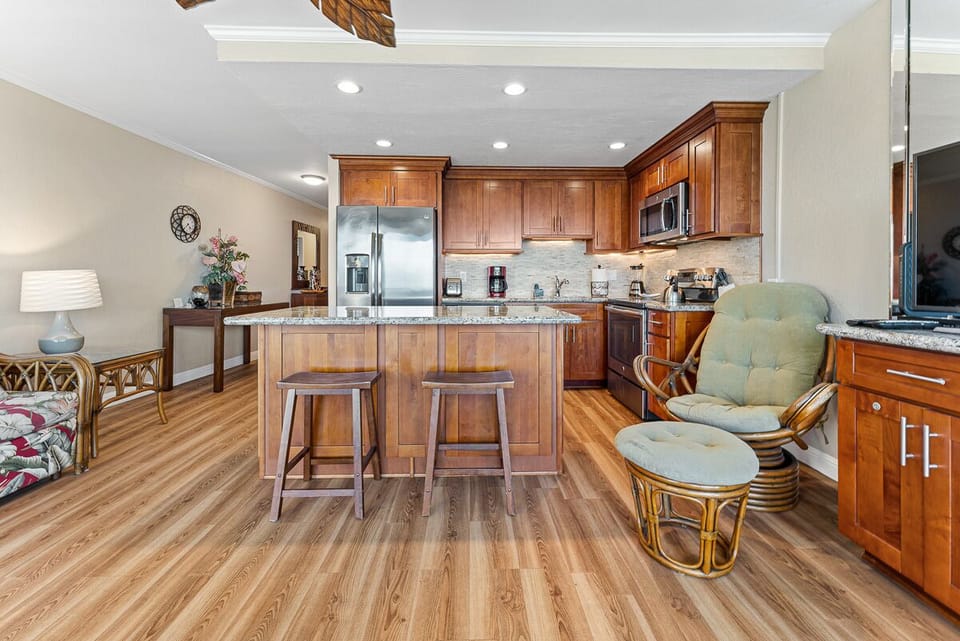 Fully remodeled with rich cherrywood cabinetry and grey granite countertops.