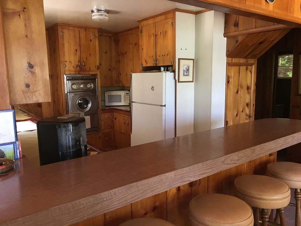 Kitchen with retro oven-works great, microwave, coffee maker, and refrigerator.