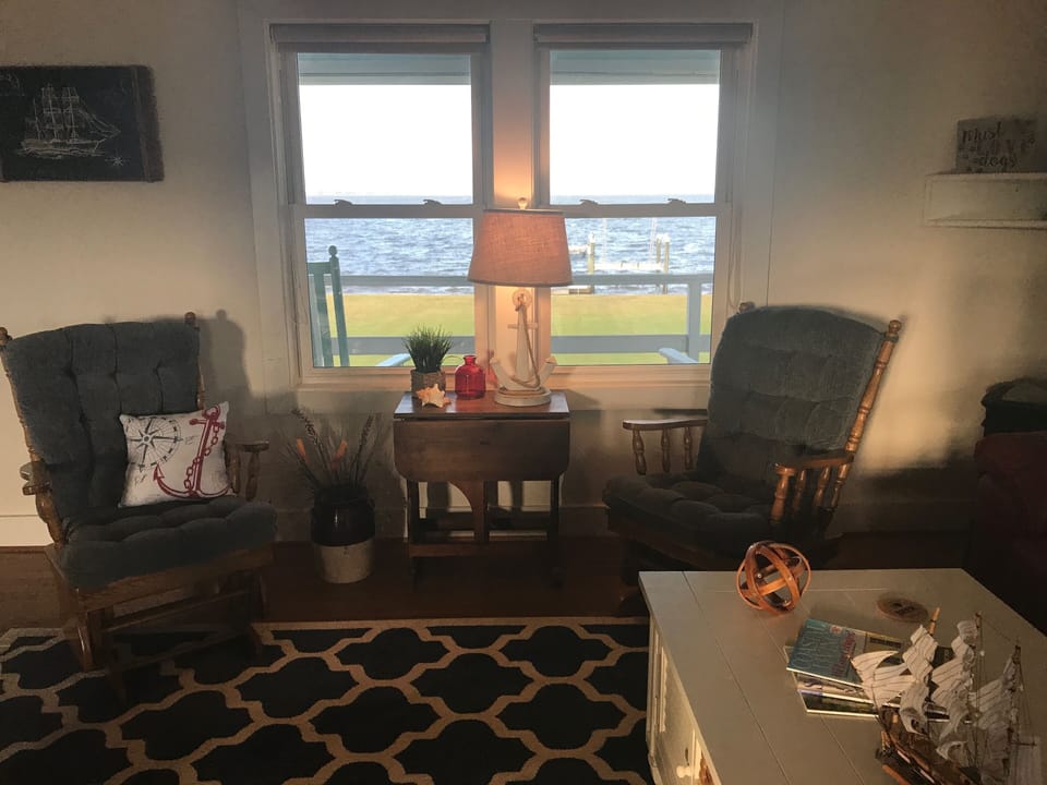 Living room.Includes 2 gliders, 2 recliners & couch with recliners on each end.