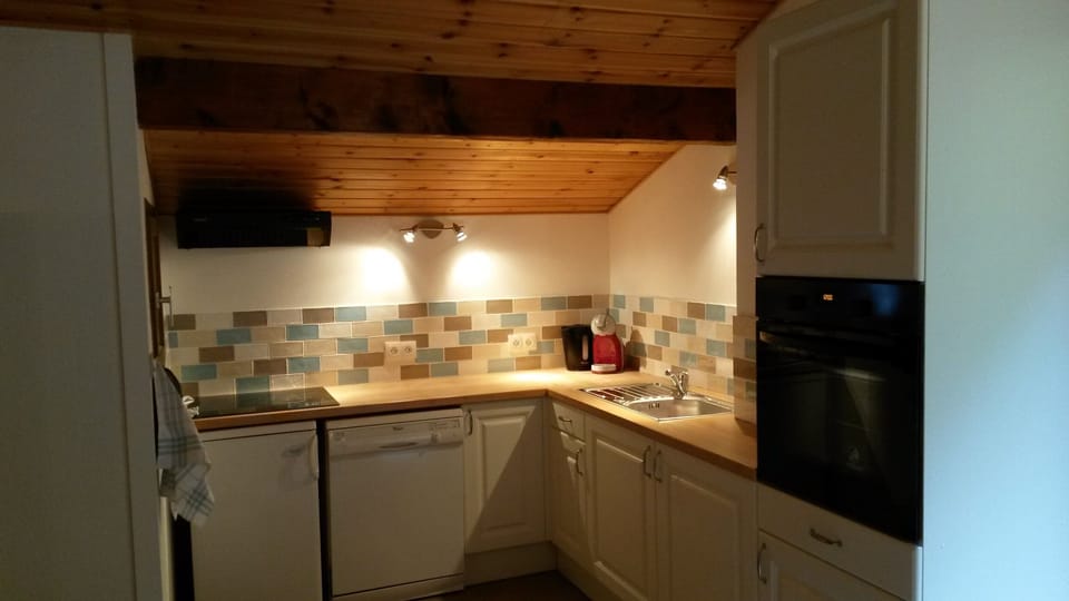 Kitchen showing ceramic hob and oven