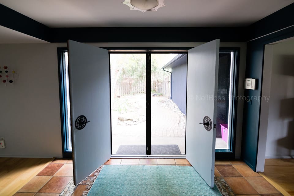 Extra wide double doors open onto private courtyard.  Screen doors keep bugs out