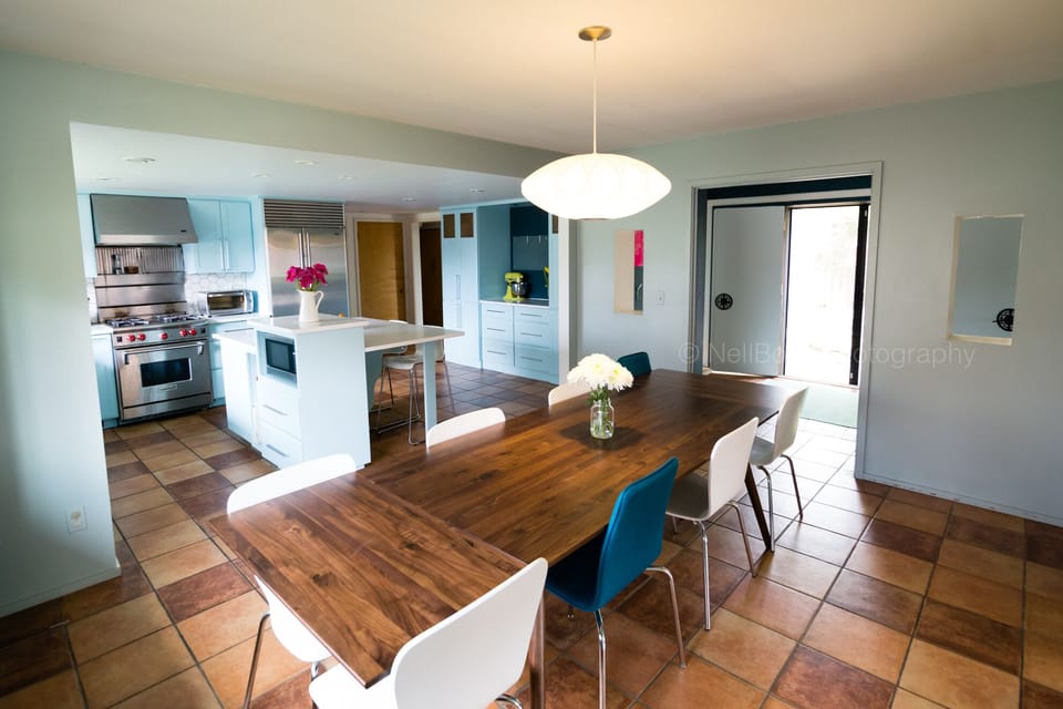 Dining room with table for 12, open to kitchen, entry and front living room