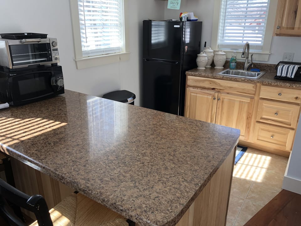 kitchenette - fridge, toaster oven, microwave, Keurig, griddle, and hot plate