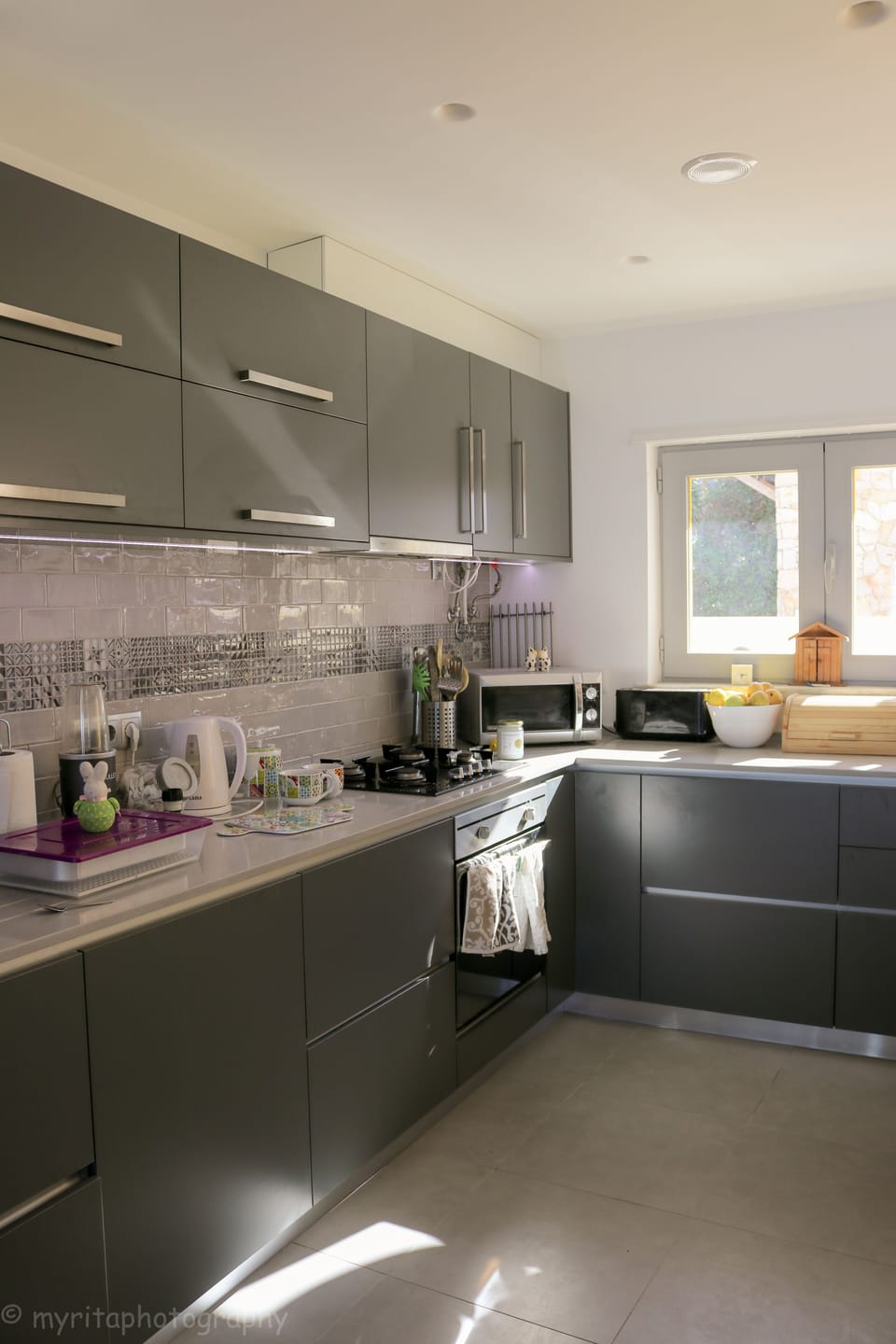 Kitchen area with oven and microwave