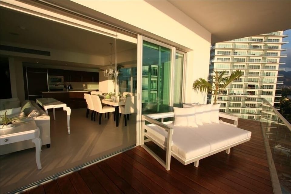 Balcony with super comfortable daybed!
State of the art kitchen in the back.