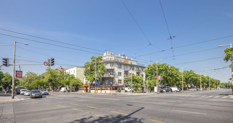 Our house on the corner with the terrace apartments on the top floor