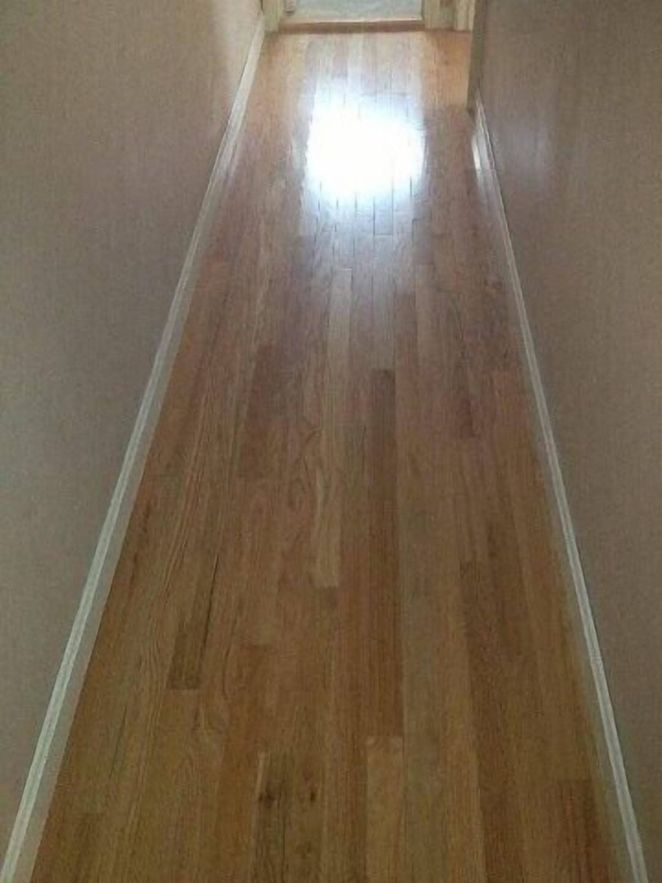Unit 6 upstairs all new hardwood floors!  (Hall) 