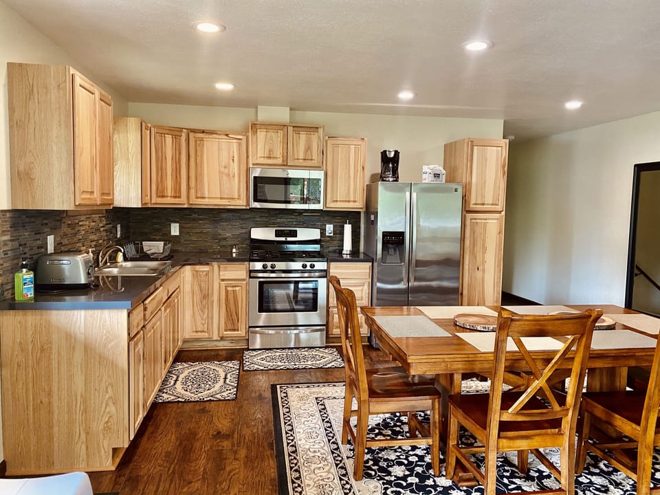 Fort Alaska's full kitchen includes gas range, oven, microwave, freezer & fridge