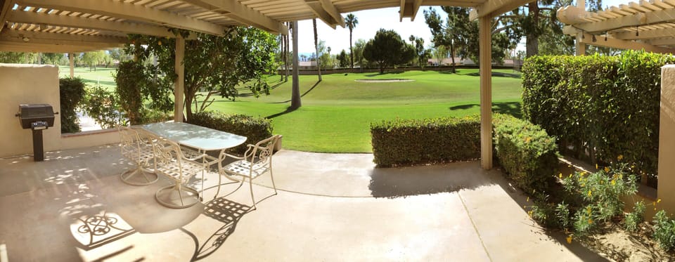 View out the back to the patio and golf course.