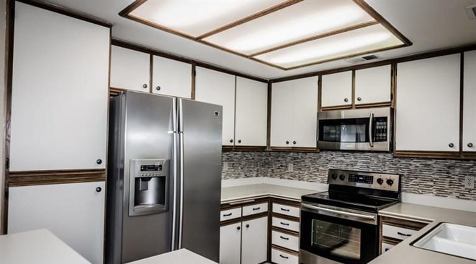 New stainless appliances in kitchen.