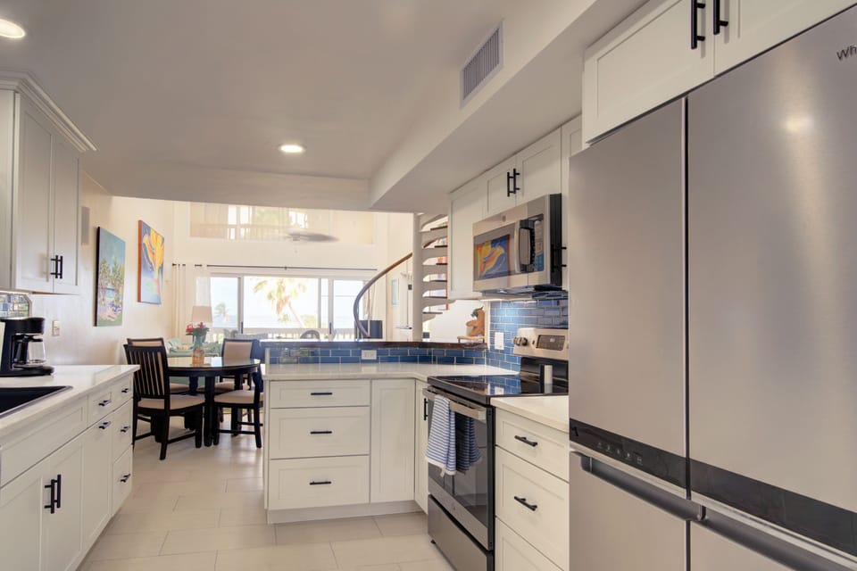 Newly Renovated Kitchen and View To The Caribbean. 